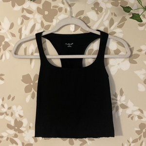 black cropped tank top/cami. scooped neckline and racerback back.
